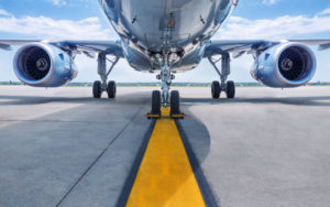 Air freight plane on runway with yellow runway line